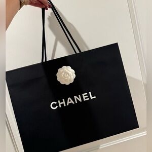 Chanel shopping bag with flower accessories​​​​